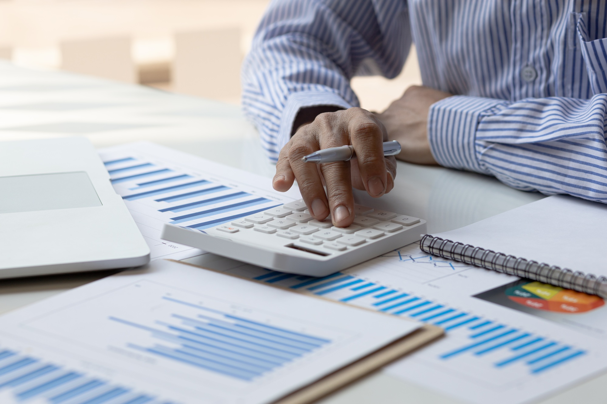 Businessman calculate financial results in the office and tax, accounting, statistics and financial