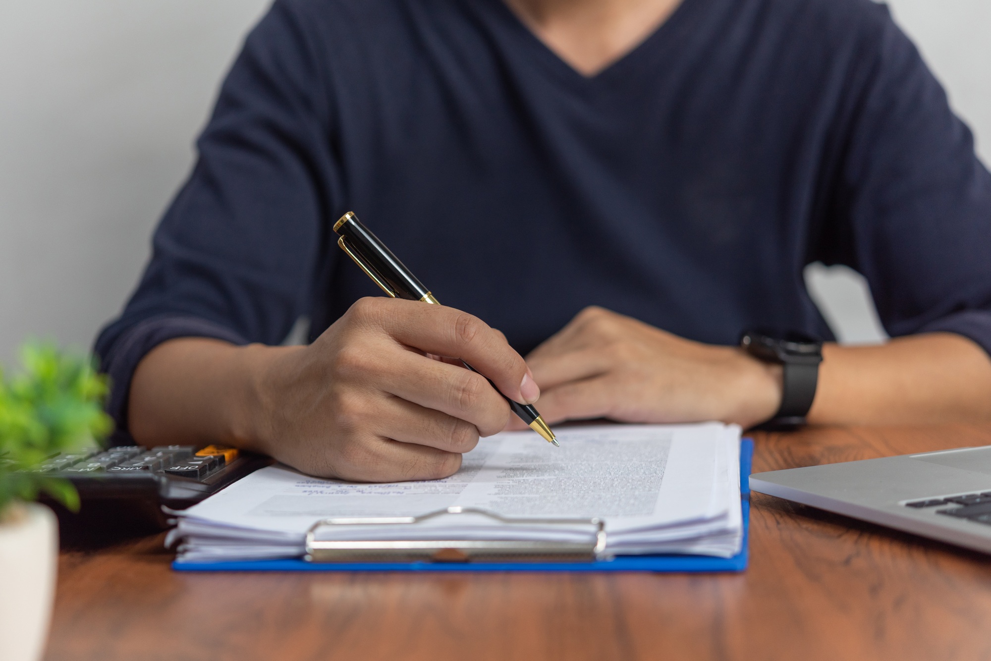 Businessman checking document data accounting and paperwork tax finance